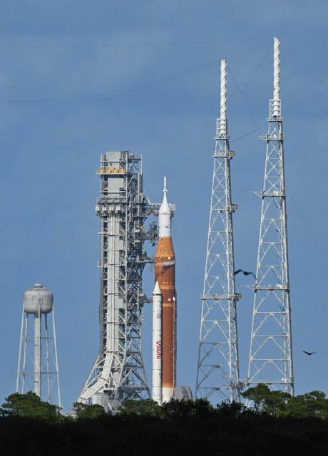 NASA's Artemis II Space Launch System rocket and Orion spacecraft rest on Launch Pad 39B at Kennedy Space Center in Cape Canaveral, Florida, on April 1, 2026, ahead of the crewed lunar mission. Three men and one woman are set to embark on the first crewed journey to the Moon since 1972, a landmark odyssey that aims to launch the US into a new era of space exploration. The NASA mission dubbed Artemis 2 has been years in the making after facing repeated setbacks, but is finally scheduled to take off from Florida as early as April 1 at 6:24 pm (2224 GMT). (Photo by Jim WATSON / AFP)