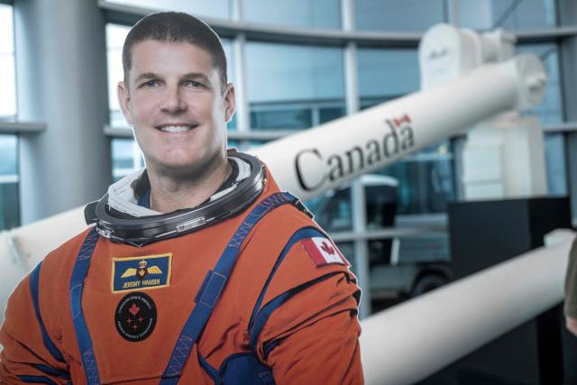 A cardboard cutout of Canadian astronaut Jeremy Hansen at the Canadian Space Agency (CSA) before a viewing party of the Artemis II launch, in Longueuil, near Montreal, Quebec, on April 1, 2026. Three men and one woman are set to embark on the first crewed journey to the Moon since 1972, a landmark odyssey that aims to launch the US into a new era of space exploration. The NASA mission dubbed Artemis II has been years in the making after facing repeated setbacks, but is finally scheduled to take off from Florida as early as April 1 at 6:24 pm (2224 GMT). (Photo by ANDREJ IVANOV / AFP)