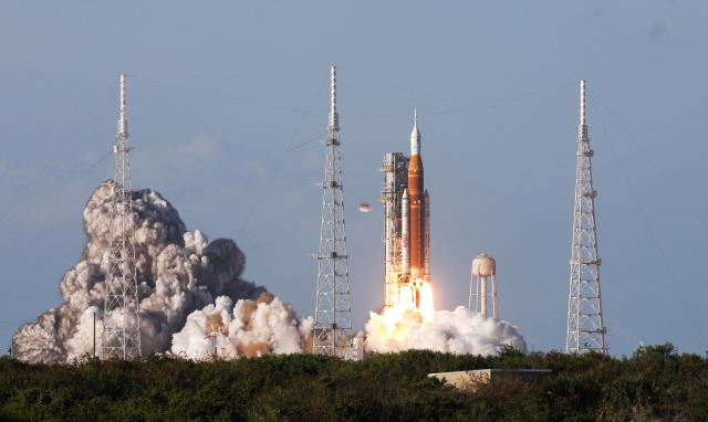 The Artemis II crewed lunar mission launches at Kennedy Space Center in Cape Canaveral, Florida, on April 1, 2026. Four astronauts blasted off aboard a massive NASA rocket April 1 on a long-anticipated journey around the Moon, the first crewed lunar flyby in more than 50 years. With an intense roar that reverberated far beyond the launchpad, the enormous orange-and-white rocket carried three Americans and one Canadian away from Florida's Kennedy Space Center at approximately 6:35 pm local time, according to an AFP journalist onsite. "We're going to the Moon!" yelled a spectator. (Photo by Gregg Newton / AFP)