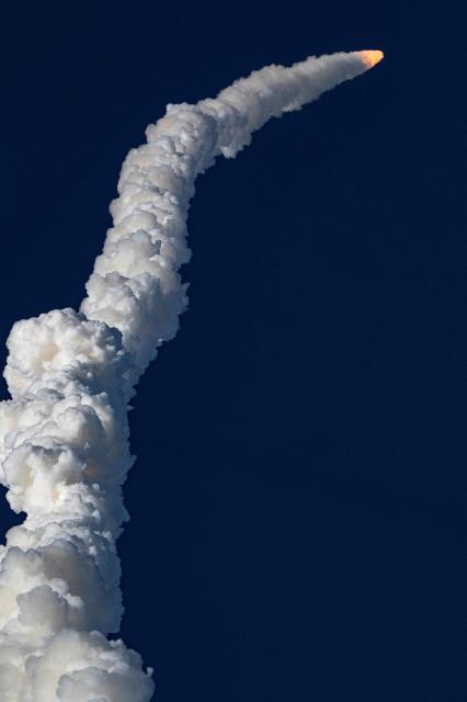 The Artemis II crewed lunar mission launches at Kennedy Space Center in Cape Canaveral, Florida, on April 1, 2026. Four astronauts blasted off aboard a massive NASA rocket April 1 on a long-anticipated journey around the Moon, the first crewed lunar flyby in more than 50 years. With an intense roar that reverberated far beyond the launchpad, the enormous orange-and-white rocket carried three Americans and one Canadian away from Florida's Kennedy Space Center at approximately 6:35 pm local time, according to an AFP journalist onsite. "We're going to the Moon!" yelled a spectator. (Photo by Jim WATSON / AFP)