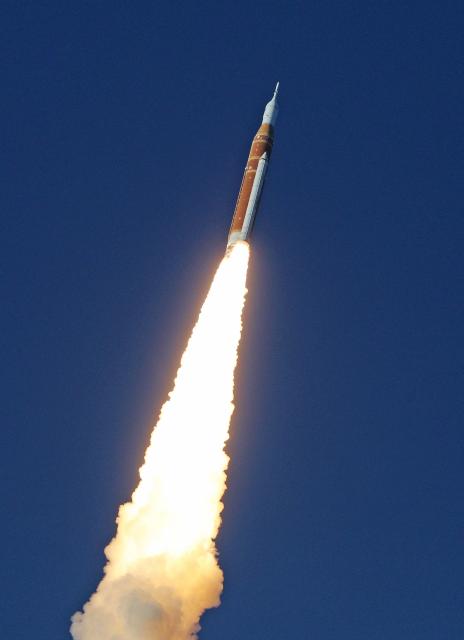 NASA's Artemis II Space Launch System (SLS) rocket and Orion spacecraft soars into orbit after lifting off from Launch Pad 39B at the Kennedy Space Center in Cape Canaveral, Florida on April 1, 2026. Four astronauts blasted off aboard a massive NASA rocket April 1 on a long-anticipated journey around the Moon, the first crewed lunar flyby in more than 50 years. With an intense roar that reverberated far beyond the launchpad, the enormous orange-and-white rocket carried three Americans and one Canadian away from Florida's Kennedy Space Center at approximately 6:35 pm local time, according to an AFP journalist onsite. "We're going to the Moon!" yelled a spectator. (Photo by Gregg Newton / AFP)