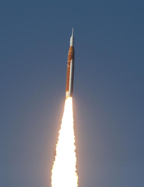 NASA's Artemis II Space Launch System (SLS) rocket and Orion spacecraft soars into orbit after lifting off from Launch Pad 39B at the Kennedy Space Center in Cape Canaveral, Florida on April 1, 2026. Four astronauts blasted off aboard a massive NASA rocket April 1 on a long-anticipated journey around the Moon, the first crewed lunar flyby in more than 50 years. With an intense roar that reverberated far beyond the launchpad, the enormous orange-and-white rocket carried three Americans and one Canadian away from Florida's Kennedy Space Center at approximately 6:35 pm local time, according to an AFP journalist onsite. "We're going to the Moon!" yelled a spectator. (Photo by Gregg Newton / AFP)