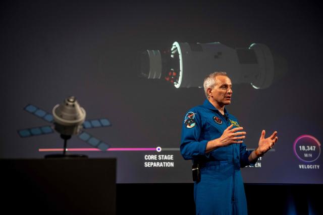 Canadian astronaut David Saint-Jacques, of the Canadian Space Agency (CSA), talks about the Artemis II lunar mission to attendees of a viewing party of the Artemis II launch, in Longueuil, near Montreal, Quebec, on April 1, 2026. Four astronauts blasted off aboard a massive NASA rocket April 1 on a long-anticipated journey around the Moon, the first crewed lunar flyby in more than 50 years. With an intense roar that reverberated far beyond the launchpad, the enormous orange-and-white rocket carried three Americans and one Canadian away from Florida's Kennedy Space Center at approximately 6:35 pm local time, according to an AFP journalist onsite. "We're going to the Moon!" yelled a spectator. (Photo by ANDREJ IVANOV / AFP)