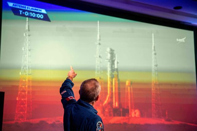 Canadian astronaut David Saint-Jacques, of the Canadian Space Agency (CSA), talks about the Artemis II lunar mission to attendees of a viewing party of the Artemis II launch, in Longueuil, near Montreal, Quebec, on April 1, 2026. Four astronauts blasted off aboard a massive NASA rocket April 1 on a long-anticipated journey around the Moon, the first crewed lunar flyby in more than 50 years. With an intense roar that reverberated far beyond the launchpad, the enormous orange-and-white rocket carried three Americans and one Canadian away from Florida's Kennedy Space Center at approximately 6:35 pm local time, according to an AFP journalist onsite. "We're going to the Moon!" yelled a spectator. (Photo by ANDREJ IVANOV / AFP)