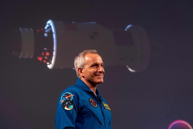 Canadian astronaut David Saint-Jacques, of the Canadian Space Agency (CSA), talks about the Artemis II lunar mission to attendees of a viewing party of the Artemis II launch, in Longueuil, near Montreal, Quebec, on April 1, 2026. Four astronauts blasted off aboard a massive NASA rocket April 1 on a long-anticipated journey around the Moon, the first crewed lunar flyby in more than 50 years. With an intense roar that reverberated far beyond the launchpad, the enormous orange-and-white rocket carried three Americans and one Canadian away from Florida's Kennedy Space Center at approximately 6:35 pm local time, according to an AFP journalist onsite. "We're going to the Moon!" yelled a spectator. (Photo by ANDREJ IVANOV / AFP)