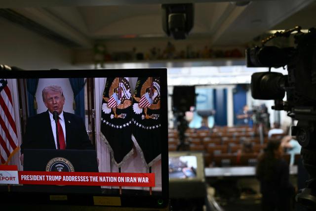 The televised address of US President Donald Trump is seen at the James Brady Press Briefing Room of the White House in Washington, DC on April 1, 2026. (Photo by Brendan SMIALOWSKI / AFP)