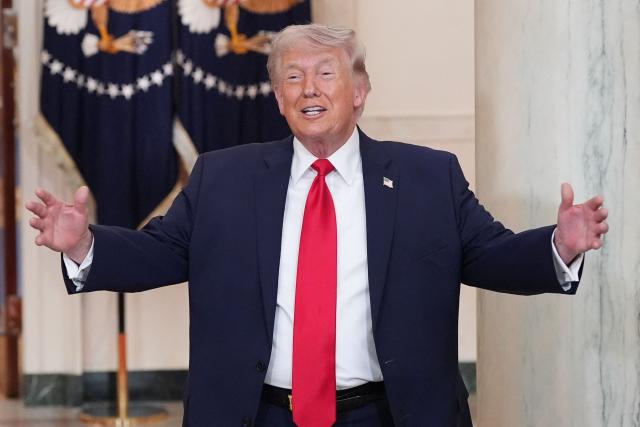 US President Donald Trump gestures after speaking at a televised address on the conflict in the Middle East from the Cross Hall of the White House in Washington, DC on April 1, 2026. (Photo by Alex Brandon / POOL / AFP)