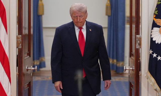 US President Donald Trump arrives to speak at a televised address on the conflict in the Middle East from the Cross Hall of the White House in Washington, DC on April 1, 2026. US President Donald Trump vowed to attack Iran relentlessly over the coming two to three weeks, saying American forces were nearing completion of the war. (Photo by Alex Brandon / POOL / AFP)