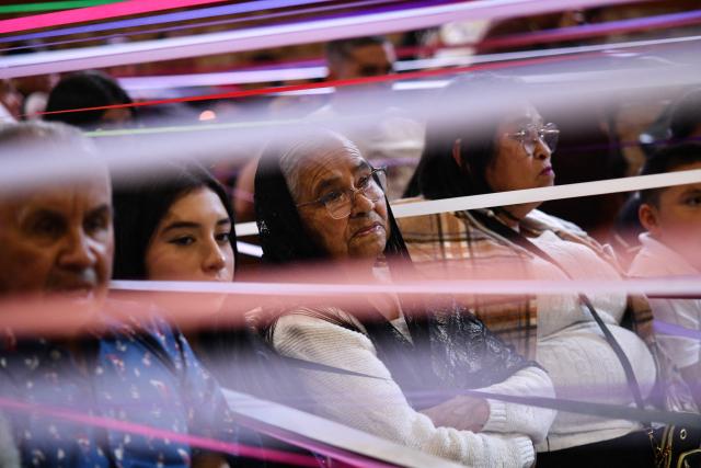 Catholic faithful take part in a mass at the San Antonio de Padua church, ahead of a procession known as "Jesus Nazareno of the tapes," during the Holy Week in Cartago, Costa Rica on April 1, 2026. (Photo by Ezequiel BECERRA / AFP)