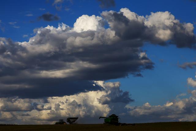 TOPSHOT - Harvest machines work in a soybean field in Cruz Alta, Rio Grande do Sul state, Brazil, on April 1, 2026. (Photo by Silvio AVILA / AFP)