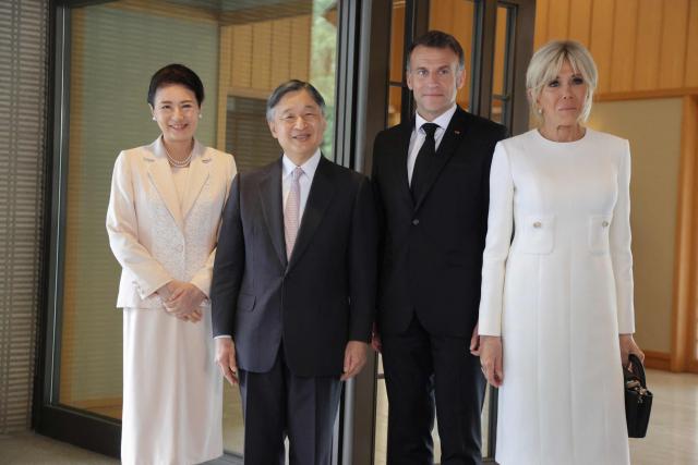 France's President Emmanuel Macron (2nd-R) and First Lady Brigitte Macron (R) pose with Japan's Emperor Naruhito (2nd-L) and Empress Masako (L) at the  Imperial Palace in Tokyo on April 2, 2026. (Photo by Ludovic MARIN / POOL / AFP)