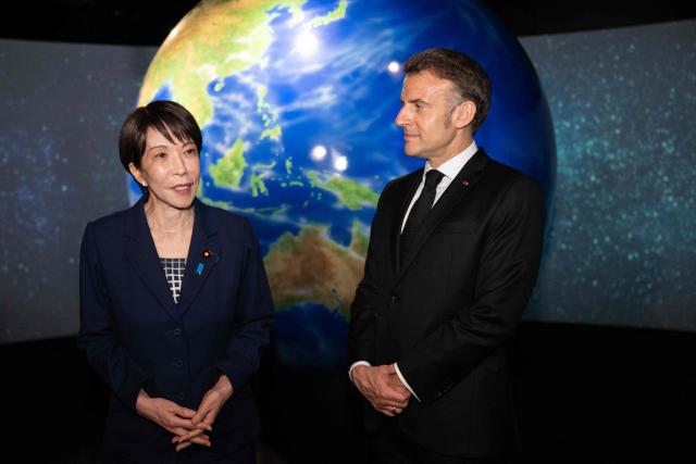 French President Emmanuel Macron (R) and Japanese Prime Minister Sanae Takaichi visit the Astroscale, a space venture company, in Tokyo on April 2, 2026. (Photo by Jeanne ACCORSINI / POOL / AFP)