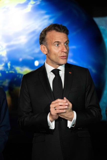 French President Emmanuel Macron visits the Astroscale, a space venture company, in Tokyo on April 2, 2026. (Photo by Jeanne ACCORSINI / POOL / AFP)