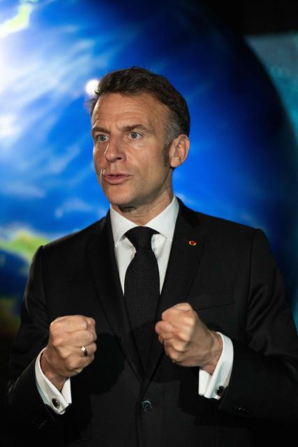 French President Emmanuel Macron visits the Astroscale, a space venture company, in Tokyo on April 2, 2026. (Photo by Jeanne ACCORSINI / POOL / AFP)