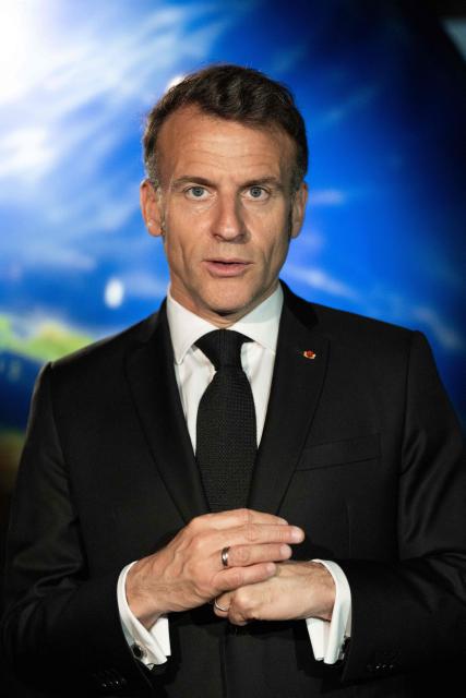 French President Emmanuel Macron visits the Astroscale, a space venture company, in Tokyo on April 2, 2026. (Photo by Jeanne ACCORSINI / POOL / AFP)