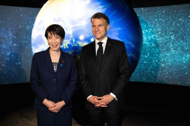 French President Emmanuel Macron (R) and Japanese Prime Minister Sanae Takaichi visit the Astroscale, a space venture company, in Tokyo on April 2, 2026. (Photo by Jeanne ACCORSINI / POOL / AFP)