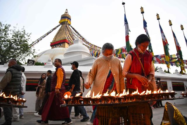 Members of the Tamang ethnic minority community gather at the Boudhanath Stupa to observe the Temal festival in Kathmandu on April 1, 2026. (Photo by Prakash MATHEMA / AFP)