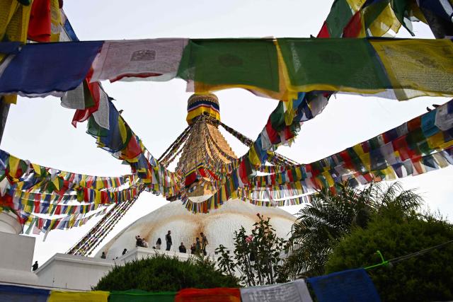 Members of the Tamang ethnic minority community gather at the Boudhanath Stupa to observe the Temal festival in Kathmandu on April 1, 2026. (Photo by Prakash MATHEMA / AFP)