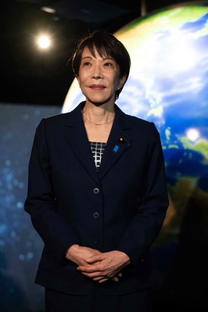 Japanese Prime Minister Sanae Takaichi visits the Astroscale, a space venture company, with French President Emmanuel Macron (not pictured) in Tokyo on April 2, 2026. (Photo by Jeanne ACCORSINI / POOL / AFP)