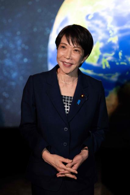 Japanese Prime Minister Sanae Takaichi visits the Astroscale, a space venture company, with French President Emmanuel Macron (not pictured) in Tokyo on April 2, 2026. (Photo by Jeanne ACCORSINI / POOL / AFP)