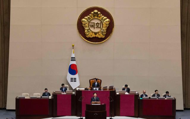 South Korean President Lee Jae Myung delivers a speech on the government's first supplemetary budget bill of 2026 at the National Assembly in Seoul on April 2, 2026. (Photo by JEON HEON-KYUN / POOL / AFP)