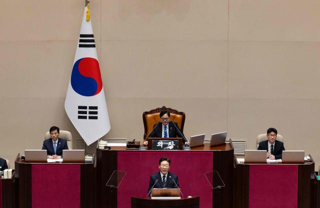 South Korean President Lee Jae Myung delivers a speech on the government's first supplemetary budget bill of 2026 at the National Assembly in Seoul on April 2, 2026. (Photo by JEON HEON-KYUN / POOL / AFP)