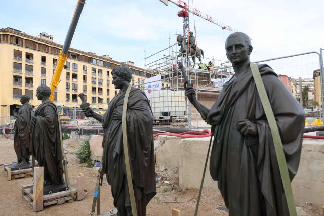 Workers operate around a statue representing Napoleon I on a horse after it was placed back on its pedestal facing the sea as part of the renovation of the Charles de Gaulle Square in Ajaccio, on the French Mediterranean island of Corsica on April 2, 2026. (Photo by Pascal POCHARD-CASABIANCA / AFP)
