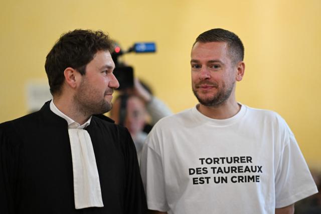 Content creator Jeremstar, whose real name is Jeremy Gisclon, arrives with his lawyer Chris Baptiste (L) for his trial at Nimes criminal court on charges of entering a competition area after interrupting a bullfight last September, in Nimes on April 2, 2026. (Photo by Gabriel BOUYS / AFP)