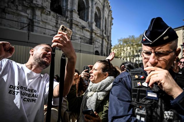 Content creator Jeremstar, whose real name is Jeremy Gisclon, poses for fans as he arrives for his trial at Nimes criminal court on charges of entering a competition area after interrupting a bullfight last September, in Nimes on April 2, 2026. (Photo by Gabriel BOUYS / AFP)