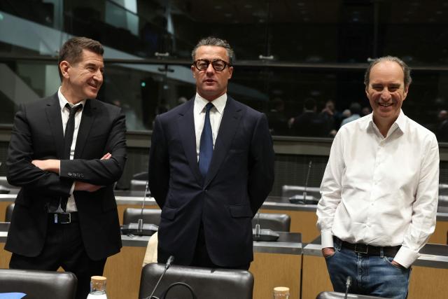(LtoR) Combat press group founder Matthieu Pigasse, KKR France president Jerome Nomme  and Iliad and Free founder Xavier Niel, all shareholders of audiovisual production group Mediawan, pose ahead of a hearing before the Commission of Inquiry into the Neutrality, Operation and Funding of Public Broadcasting at the National Assembly in Paris on April 2, 2026. (Photo by ALAIN JOCARD / AFP)