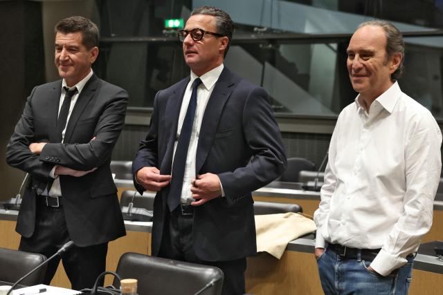 (LtoR) Combat press group founder Matthieu Pigasse, KKR France president Jerome Nomme  and Iliad and Free founder Xavier Niel, all shareholders of audiovisual production group Mediawan, pose ahead of a hearing before the Commission of Inquiry into the Neutrality, Operation and Funding of Public Broadcasting at the National Assembly in Paris on April 2, 2026. (Photo by ALAIN JOCARD / AFP)