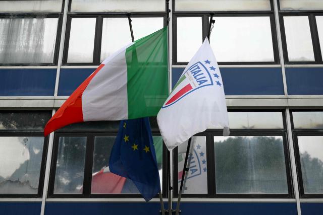 A picture shows flags of Italy and of the Italian Football Federation (FIGC)  at the  Italian Football Federation (FIGC) headquarters during a meeting of the Italian football authorities after the national team failed to qualify for a third consecutive World Cup, in Rome on April 2, 2026. (Photo by Alberto PIZZOLI / AFP)
