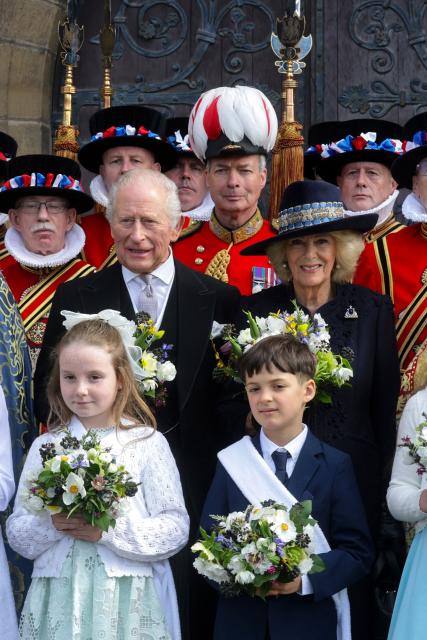Britain's King Charles III and Britain's Queen Camilla pose for a formal photograph after the Royal Maundy Service at St Asaph Cathedral, in north Wales on April 2, 2026. (Photo by Chris Jackson / POOL / AFP)