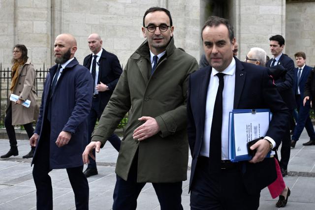 Mayor of Bordeaux Thomas Cazenave (L) greets French Prime Minister Sebastien Lecornu to discuss public safety ahead of new policing legislation at the city hall in Bordeaux on April 2, 2026, . (Photo by Philippe Lopez / AFP)