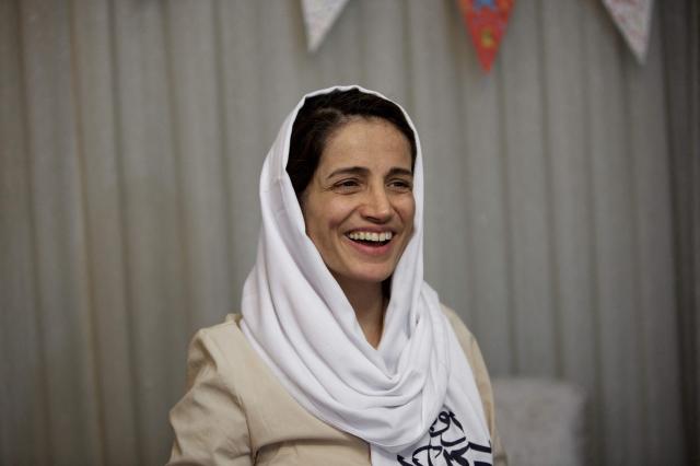 (FILES) Iranian lawyer Nasrin Sotoudeh smiles at her home in Tehran on September 18, 2013 after being freed following three years in prison. Iranian authorities have arrested Sotoudeh, her daughter said on April 2, 2026, as activists accuse the Islamic republic of cracking down on civil society during the war with Israel and the United States. (Photo by Behrouz MEHRI / AFP)