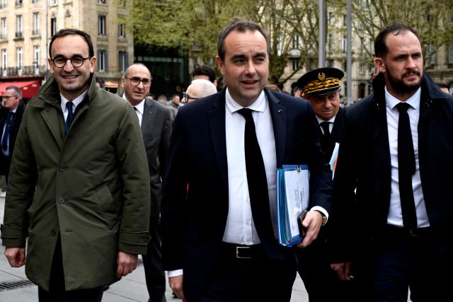 Mayor of Bordeaux Thomas Cazenave (L) greets French Prime Minister Sebastien Lecornu to discuss public safety ahead of new policing legislation at the city hall in Bordeaux on April 2, 2026, . (Photo by Philippe Lopez / AFP)
