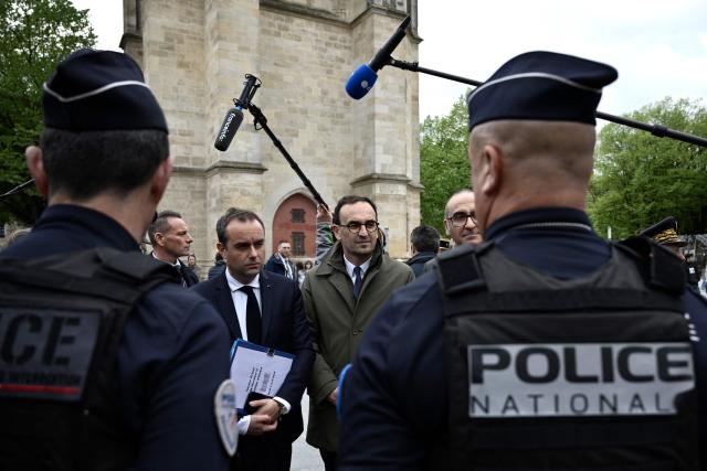 Mayor of Bordeaux Thomas Cazenave (C), France's Prime Minister Sebastien Lecornu (L) and France's Interior Minister Laurent Nunez (R) Listen to the presentation of the ERMES system for securing urban transport in Bordeaux on April 2, 2026. (Photo by Philippe Lopez / POOL / AFP)