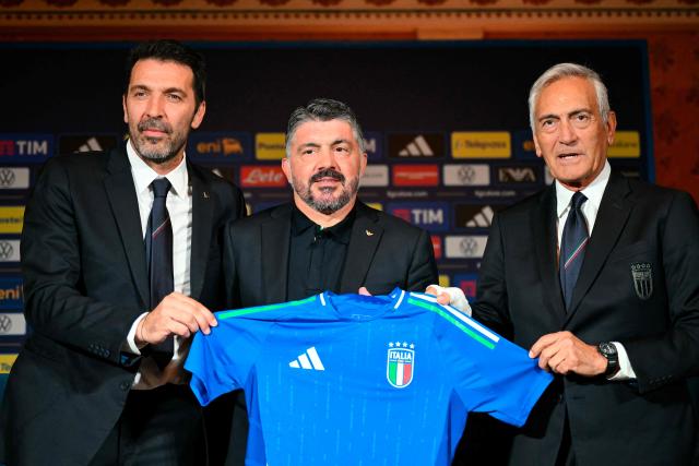 (FILES) Italy's national football team headcoach Gennaro Gattuso (C), the Head of the Delegation of the Azzurri, Gianluigi Buffon and the president of the Italian Football Federation (Figc) Gabriele Gravina (R) give a press conference in Rome on June 19, 2025. Gabriele Gravina revealed he would step down as the country's top football official following a meeting held at the FIGC's headquarters in Rome on April 02, 2026. The head of Italy's football federation resigned, falling on his sword after the men's national team failed to qualify for the World Cup for a third consecutive time. (Photo by Alberto PIZZOLI / AFP)