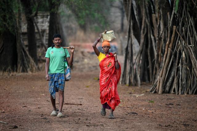 Villagers look on in Mohandi village in Chhattisgarh on April 2, 2026. (Photo by Shammi MEHRA / AFP)