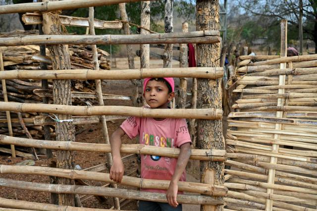 A child looks on in Mohandi village in Chhattisgarh on April 2, 2026. (Photo by Shammi MEHRA / AFP)
