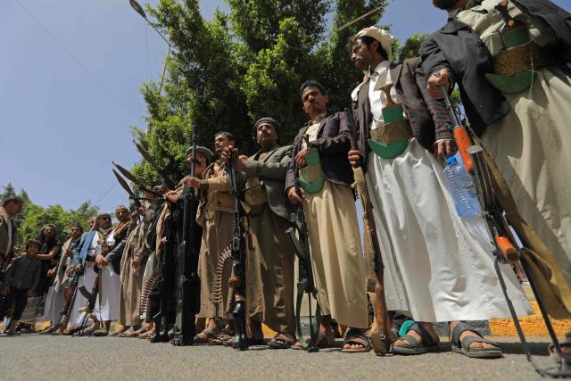 Yemeni demonstrators carrying weapons gather in Sanaa on April 2, 2026, during a protest against the Israeli parliament's approval of a new death penalty bill for Palestinians convicted of deadly attacks. The bill would make the death penalty the default punishment for Palestinians in the Israeli-occupied West Bank found guilty of intentionally carrying out deadly attacks deemed "acts of terrorism" by an Israeli military court. (Photo by Mohammed HUWAIS / AFP)