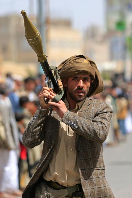 A Yemeni demonstrator carrying a weapon walks along a street in Sanaa on April 2, 2026, during a protest against the Israeli parliament's approval of a new death penalty bill for Palestinians convicted of deadly attacks. The bill would make the death penalty the default punishment for Palestinians in the Israeli-occupied West Bank found guilty of intentionally carrying out deadly attacks deemed "acts of terrorism" by an Israeli military court. (Photo by Mohammed HUWAIS / AFP)