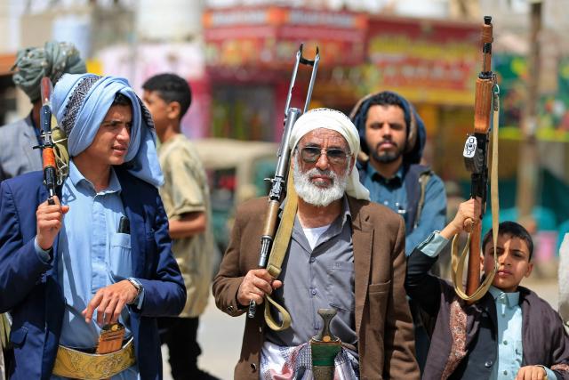Yemeni demonstrators carrying weapons gather in Sanaa on April 2, 2026, during a protest against the Israeli parliament's approval of a new death penalty bill for Palestinians convicted of deadly attacks. The bill would make the death penalty the default punishment for Palestinians in the Israeli-occupied West Bank found guilty of intentionally carrying out deadly attacks deemed "acts of terrorism" by an Israeli military court. (Photo by Mohammed HUWAIS / AFP)