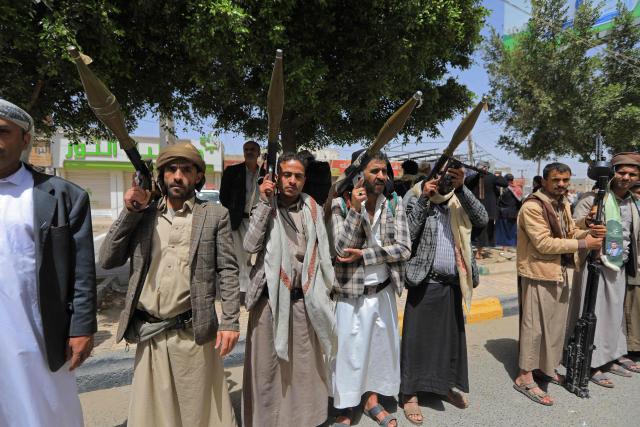Yemeni demonstrators carrying weapons gather in Sanaa on April 2, 2026, during a protest against the Israeli parliament's approval of a new death penalty bill for Palestinians convicted of deadly attacks. The bill would make the death penalty the default punishment for Palestinians in the Israeli-occupied West Bank found guilty of intentionally carrying out deadly attacks deemed "acts of terrorism" by an Israeli military court. (Photo by Mohammed HUWAIS / AFP)