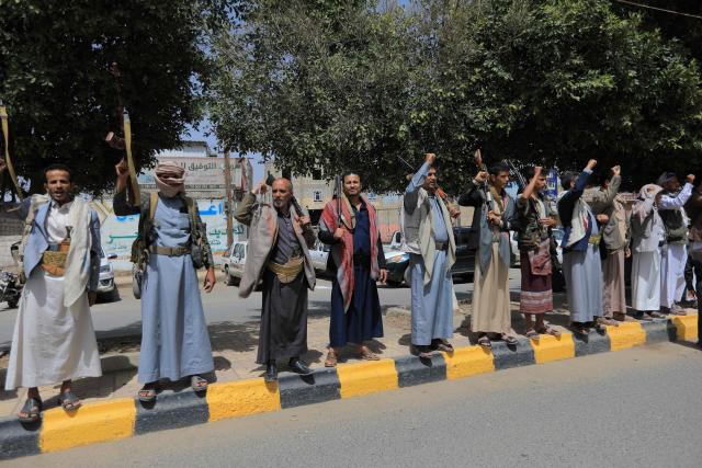 Yemeni demonstrators carrying weapons gather in Sanaa on April 2, 2026, during a protest against the Israeli parliament's approval of a new death penalty bill for Palestinians convicted of deadly attacks. The bill would make the death penalty the default punishment for Palestinians in the Israeli-occupied West Bank found guilty of intentionally carrying out deadly attacks deemed "acts of terrorism" by an Israeli military court. (Photo by Mohammed HUWAIS / AFP)
