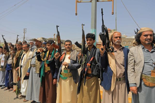 Yemeni demonstrators carrying weapons gather in Sanaa on April 2, 2026, during a protest against the Israeli parliament's approval of a new death penalty bill for Palestinians convicted of deadly attacks. The bill would make the death penalty the default punishment for Palestinians in the Israeli-occupied West Bank found guilty of intentionally carrying out deadly attacks deemed "acts of terrorism" by an Israeli military court. (Photo by Mohammed HUWAIS / AFP)