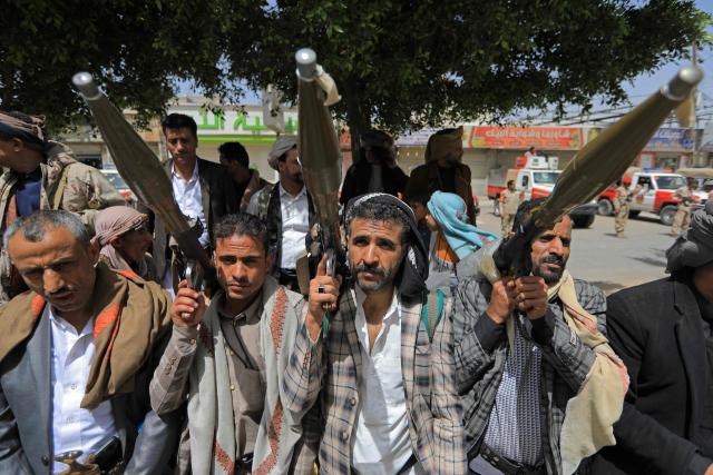 Yemeni demonstrators carrying weapons gather in Sanaa on April 2, 2026, during a protest against the Israeli parliament's approval of a new death penalty bill for Palestinians convicted of deadly attacks. The bill would make the death penalty the default punishment for Palestinians in the Israeli-occupied West Bank found guilty of intentionally carrying out deadly attacks deemed "acts of terrorism" by an Israeli military court. (Photo by Mohammed HUWAIS / AFP)
