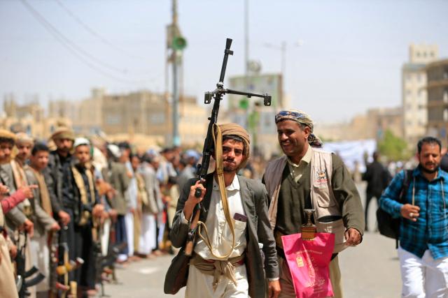 A Yemeni demonstrator carrying a weapon walks along a street in Sanaa on April 2, 2026, during a protest against the Israeli parliament's approval of a new death penalty bill for Palestinians convicted of deadly attacks. The bill would make the death penalty the default punishment for Palestinians in the Israeli-occupied West Bank found guilty of intentionally carrying out deadly attacks deemed "acts of terrorism" by an Israeli military court. (Photo by Mohammed HUWAIS / AFP)