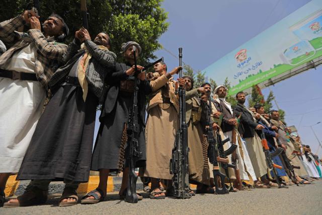 Yemeni demonstrators carrying weapons gather in Sanaa on April 2, 2026, during a protest against the Israeli parliament's approval of a new death penalty bill for Palestinians convicted of deadly attacks. The bill would make the death penalty the default punishment for Palestinians in the Israeli-occupied West Bank found guilty of intentionally carrying out deadly attacks deemed "acts of terrorism" by an Israeli military court. (Photo by Mohammed HUWAIS / AFP)