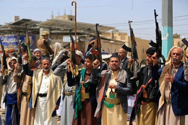 Yemeni demonstrators carrying weapons gather in Sanaa on April 2, 2026, during a protest against the Israeli parliament's approval of a new death penalty bill for Palestinians convicted of deadly attacks. The bill would make the death penalty the default punishment for Palestinians in the Israeli-occupied West Bank found guilty of intentionally carrying out deadly attacks deemed "acts of terrorism" by an Israeli military court. (Photo by Mohammed HUWAIS / AFP)
